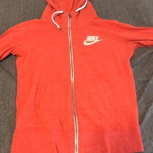 Orange Nike zip up